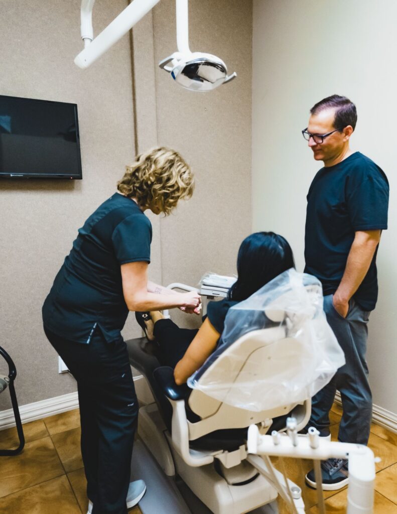 Dentist & Hygienist with Patient at Raintree Dental