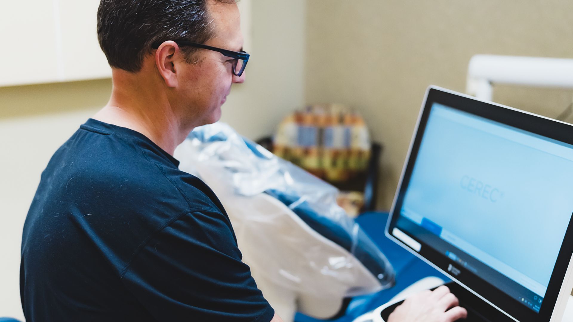 Dentist with Cerec Machine 